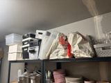 a shelf with a lot of dishes and cups on it
