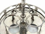 a silver tray with four cups on it