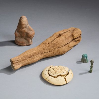 a piece of drift wood, a piece of stone, and a piece of rock