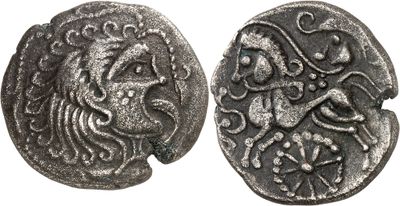 a silver coin with an image of a lion on it