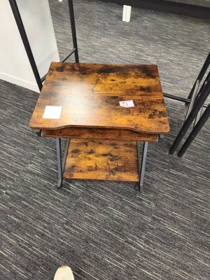 a small table with two small tables on top of it