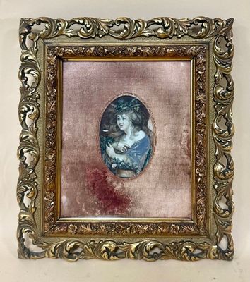 an old picture of a woman in a blue dress is hanging on a wall