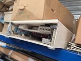 many boxes of electronics on a shelf in a store