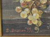 a painting of a bunch of grapes on a table