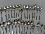 a lot of spoons and spoon spoons on the table