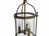 a close up of a light hanging from a ceiling fixture