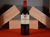 a bottle of wine that is sitting on a table