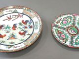 pair of chinese plates with birds and flowers on them on a table