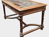 an old wooden table with a marble top on a white background