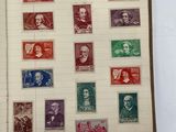 an open book with a bunch of different stamps on it
