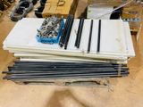 a pile of metal rods and other items on a table