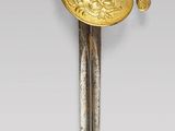 an image of a sword with a gold handle on a white background