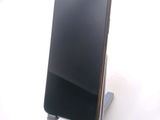 a cell phone that is sitting on a stand