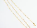 a pair of gold chain necklaces on a white background