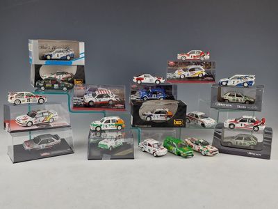 a group of die - cast cars are displayed in a display case