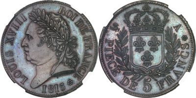 a close up of a coin with a crown on top of it