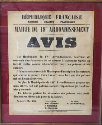 framed photograph of a poster in a frame on the wall of a building