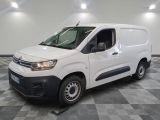 the white van is parked on a checkered floor in a room