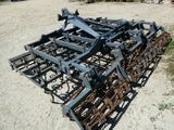 an image of a tractor plow in the dirt