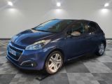 a blue car parked in a garage with a checkered floor