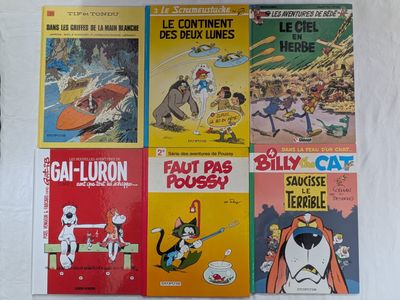 plusieurs livres pour enfants sont alignés sur une surface blanche