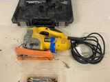 a tool that is sitting on a table next to a tool case