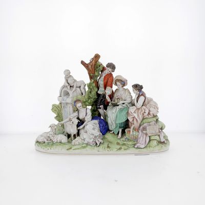 a figurine of a group of people sitting on a bench