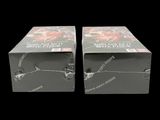 two boxes of cigarettes are sitting side by side on a black background