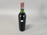 a bottle of wine that is sitting on a table