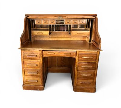 an image of a wooden desk with drawers and a desk top
