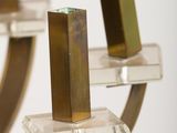 two candles that are on a stand on a table
