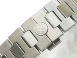 a close up of a watch bracelet with a smiley face on it