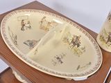 a picture of a table with a plate and a vase on it