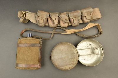 an image of a group of items including a belt, a bottle, and a belt