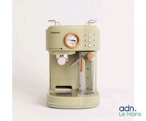 a small coffee machine that is sitting on a table