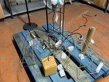 a wooden pallet with a bunch of wires on top of it