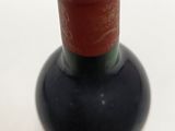 a bottle of wine that is sitting on a table