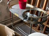 a small table with a red cup on top of it