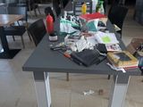 a table with many items on it in a room