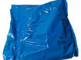 a blue bag of food sitting on top of a white table
