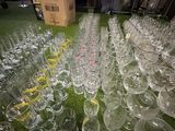 a lot of empty wine glasses on the floor