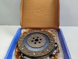 the box is open with a clutch in it on a white surface