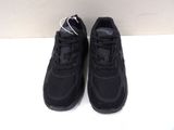 black nike air max sneakers with white laces on a white surface