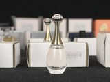 several bottles of perfume are lined up on a table