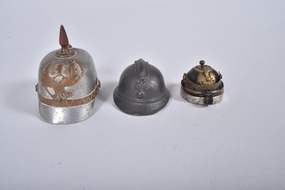 three different types of helmets are sitting on a white surface