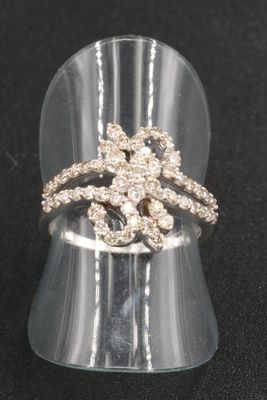 clear acrylic ring with clear stones on top of it