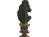 an image of a statue of a man sitting on top of a wooden base