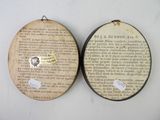 two pieces of paper hanging on the wall