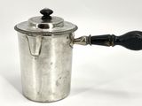 an old silver coffee pot with a wooden handle on a white background