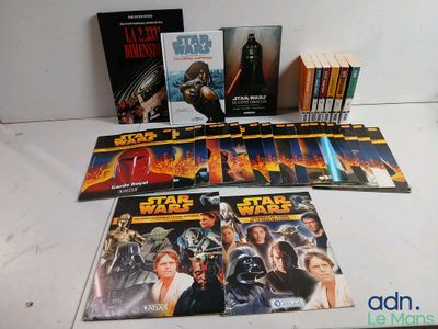 many star wars books and dvds on the table